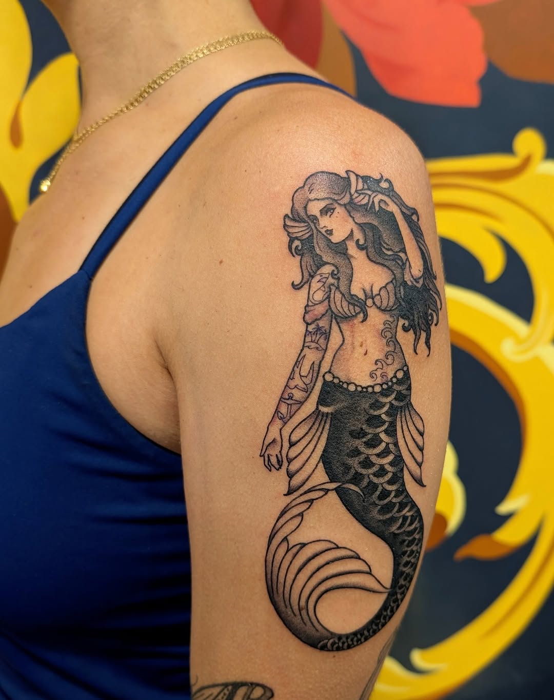 Bold traditional siren mermaid with flowing hair and scales