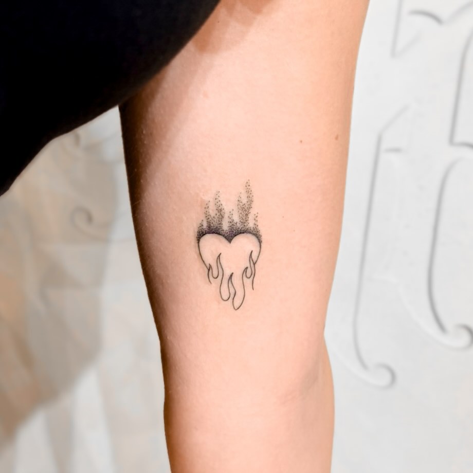 Tiny melting heart with dripping linework and dot shading.