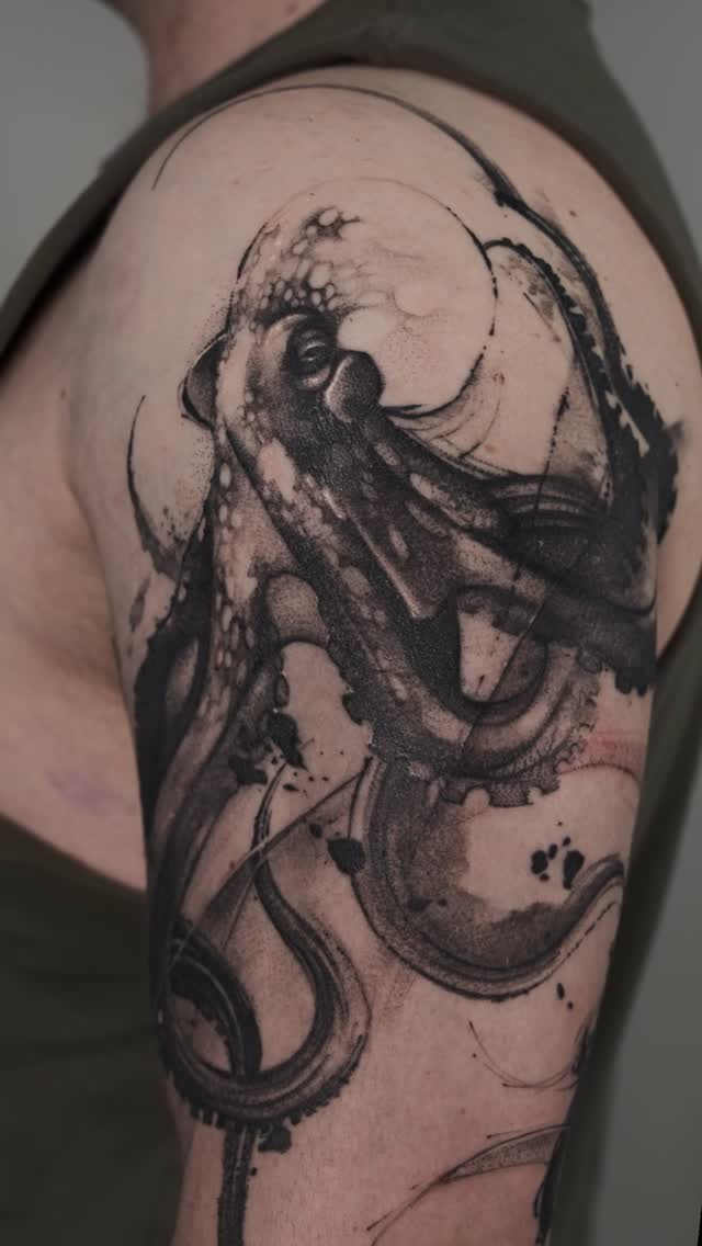 Sinuous blackwork octopus with splashy dotwork and fluid lines