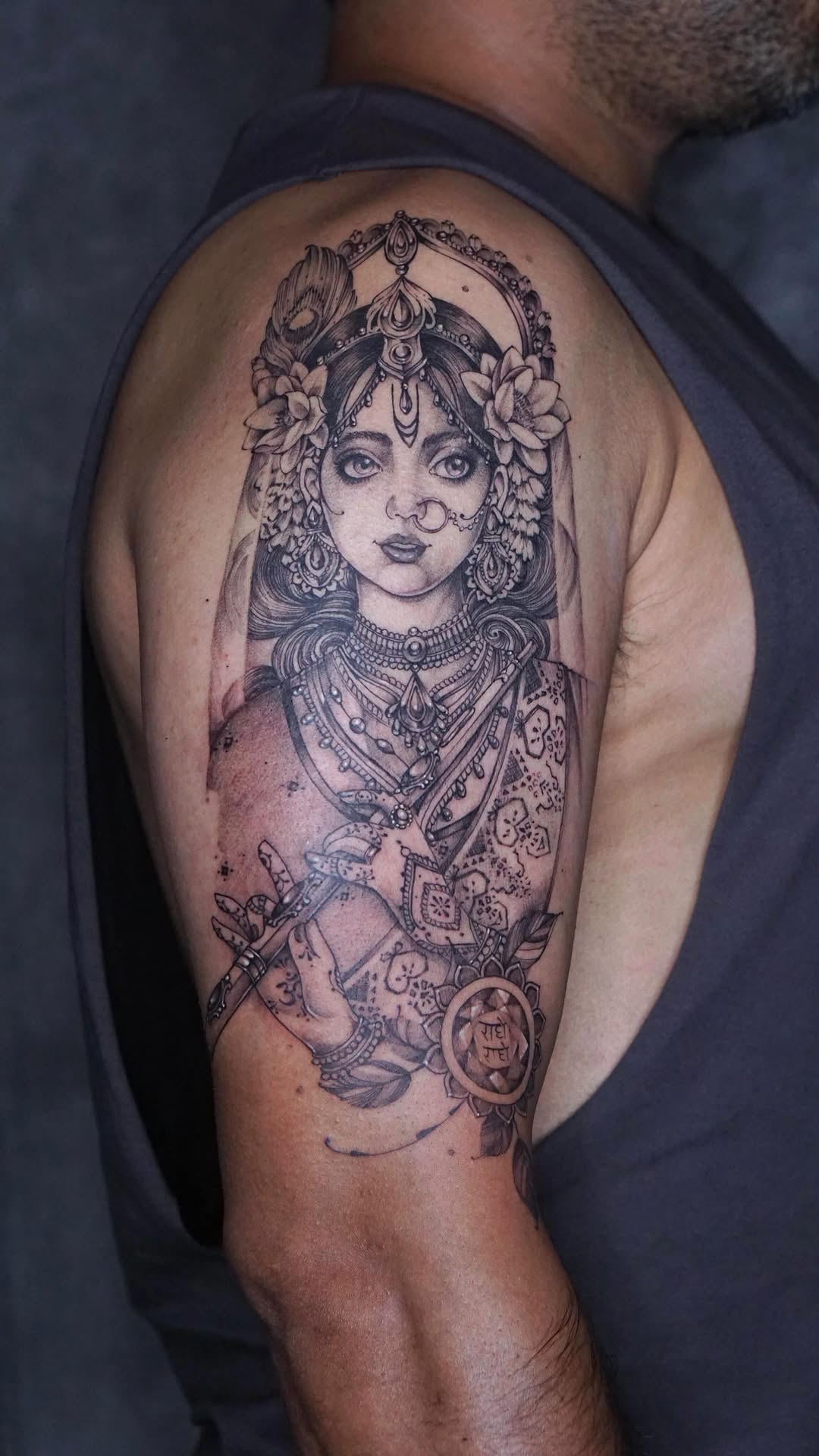 Intricate black-and-gray Radha portrait with ornate jewelry