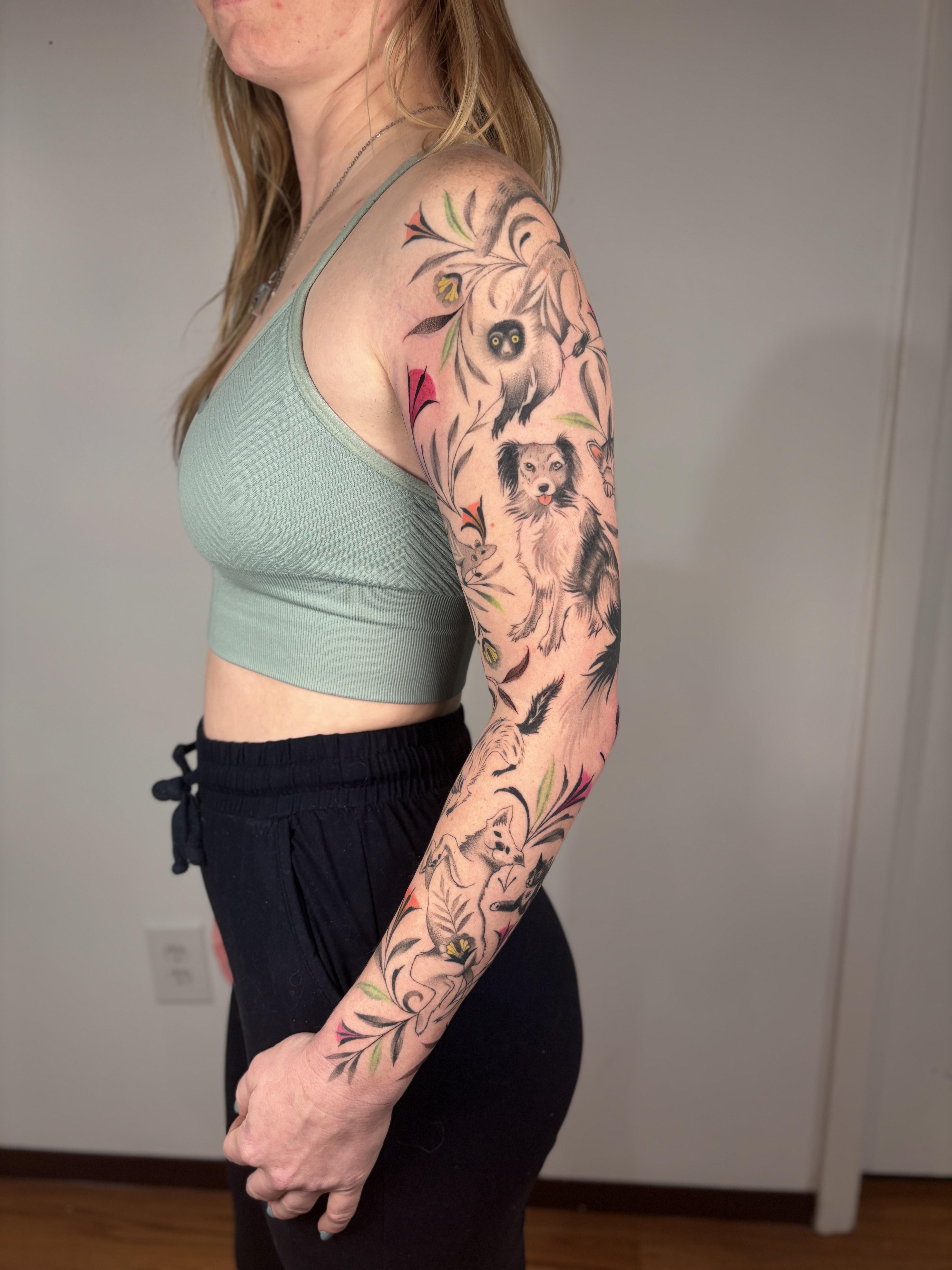 Bold animal sleeve with owl, cat-like figure, leaves.