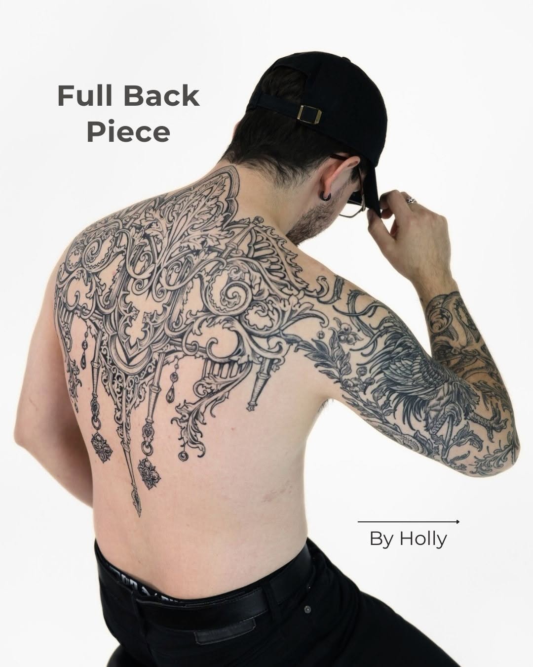 Elaborate blackwork backpiece with flowing baroque filigree