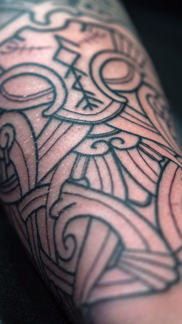 Bold Nordic knotwork with geometric ornamental linework