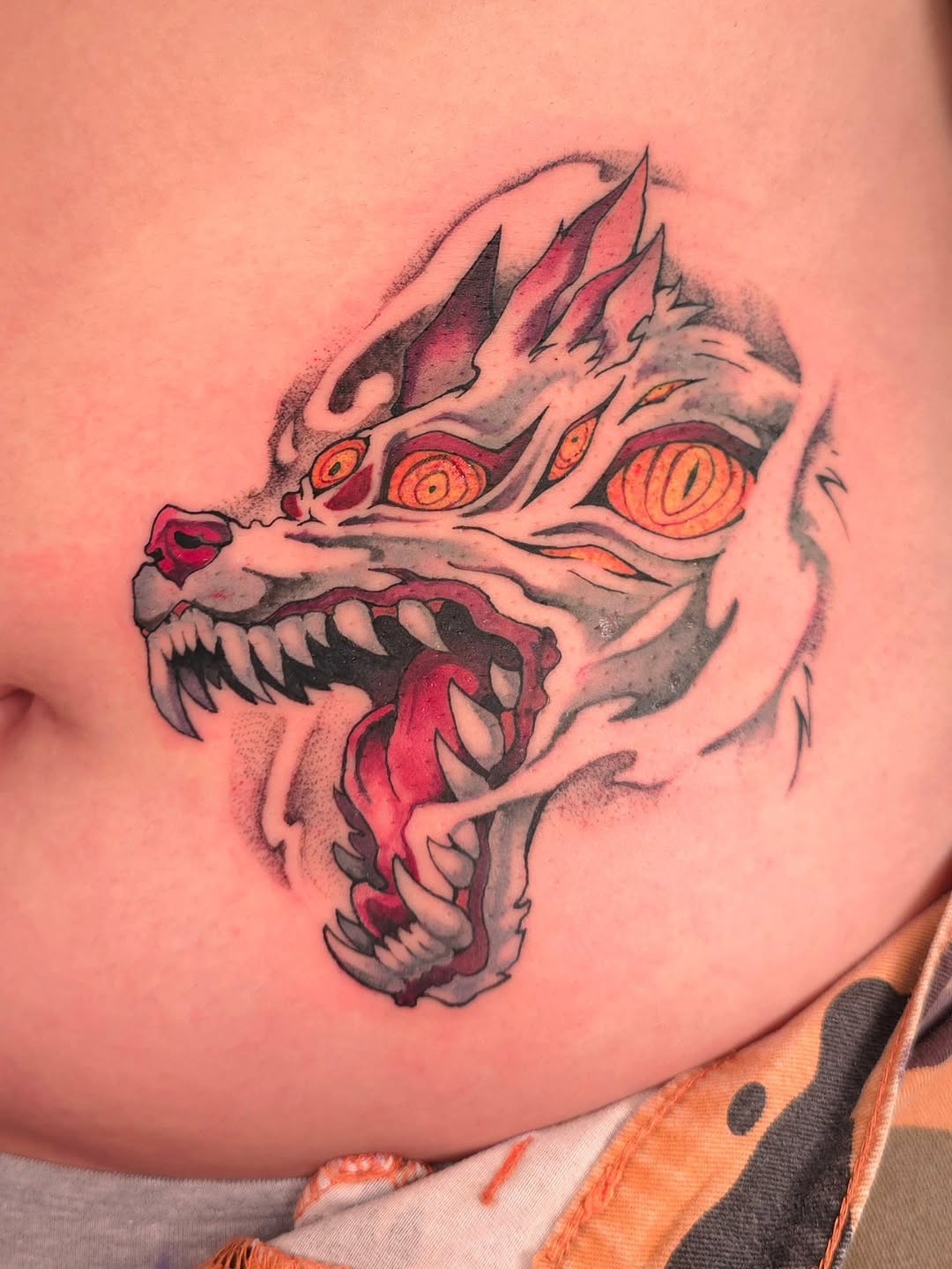 Aggressive wolf head snarling in bold neo-traditional style