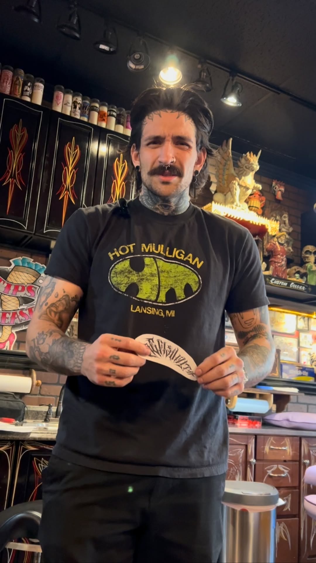 Bold blackwork sleeve with intricate linework across arms