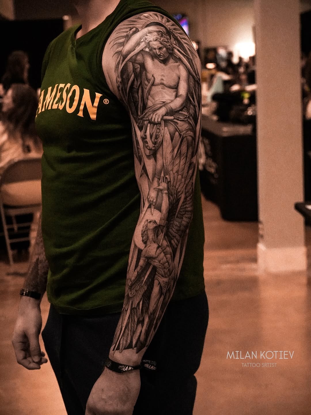 Intricate grayscale angelic-demon sleeve with feathered wings