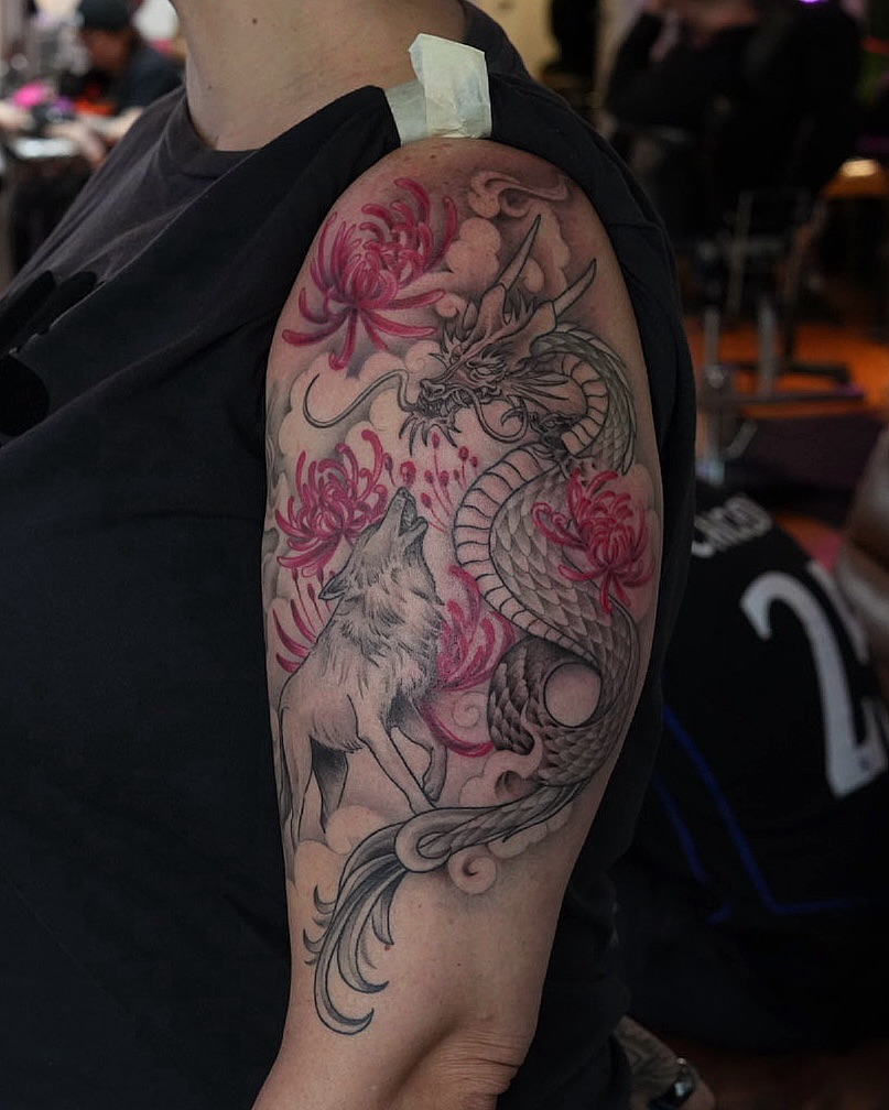 Dramatic dragon-wolf sleeve with pink chrysanthemum blossoms