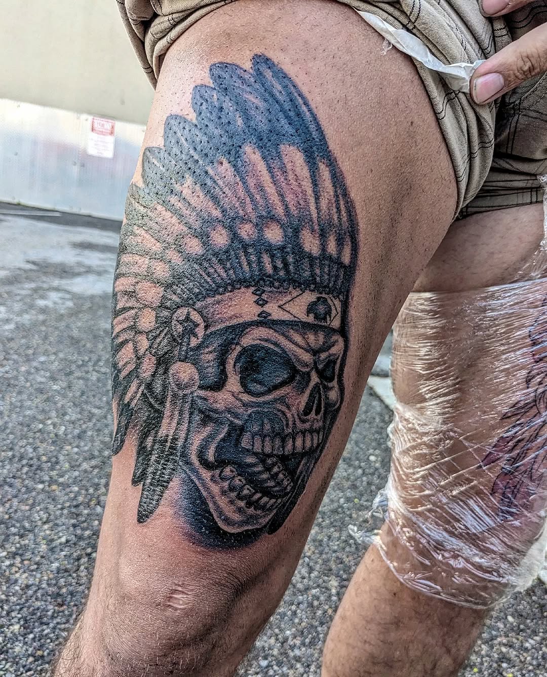 Bold skull with feathered war-headdress, striking blackwork