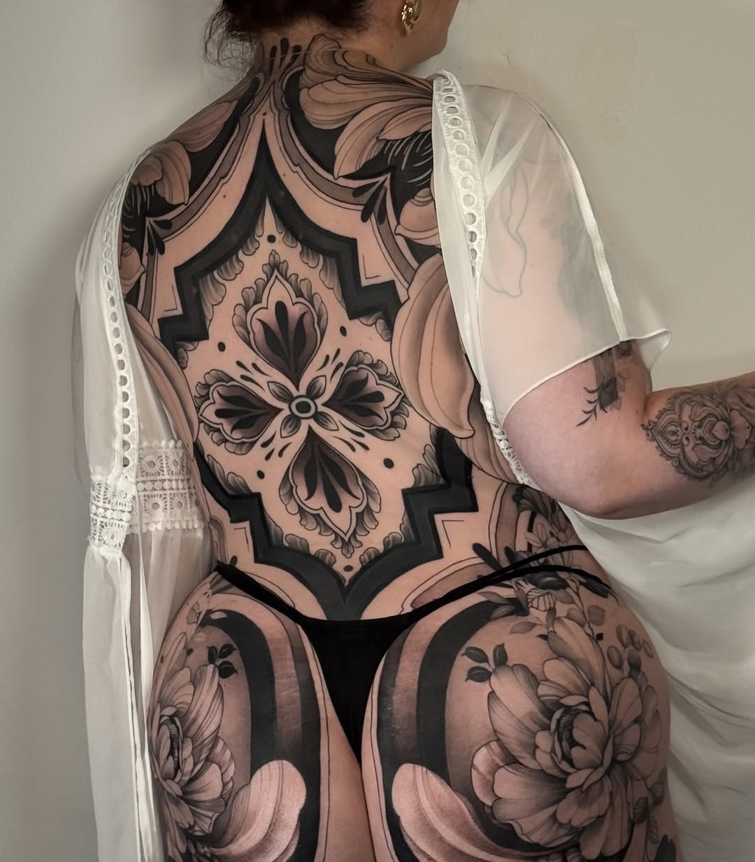 Grand blackwork backpiece with ornate floral mandala