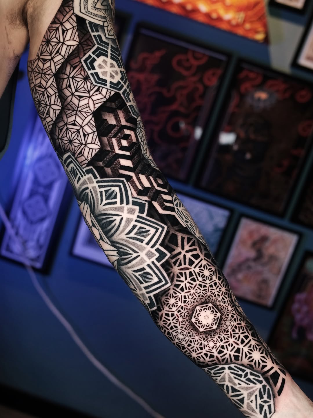 Highly structured black geometric sleeve with spiraling hexagons and tessellations