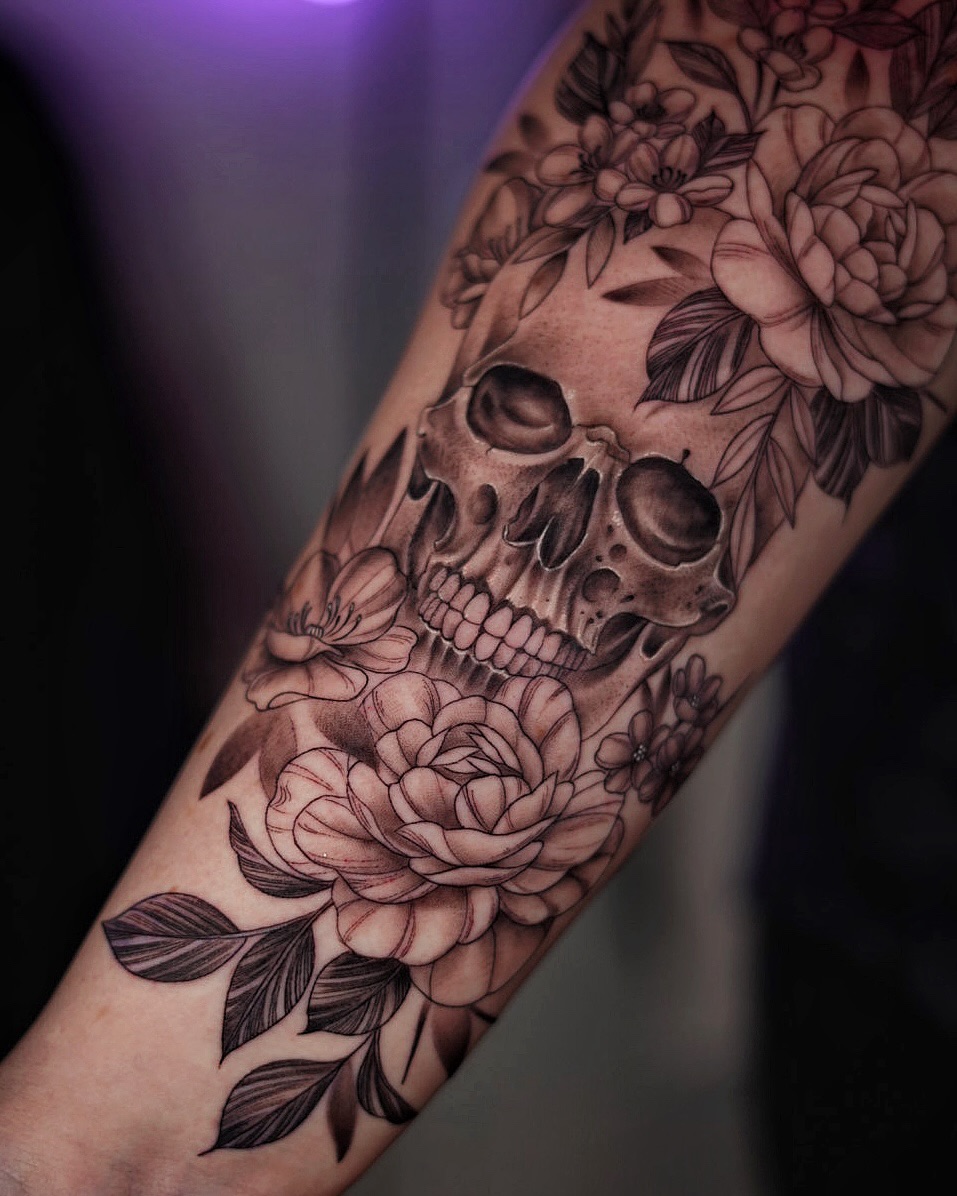 Intricate skull entwined with lush peony blooms.
