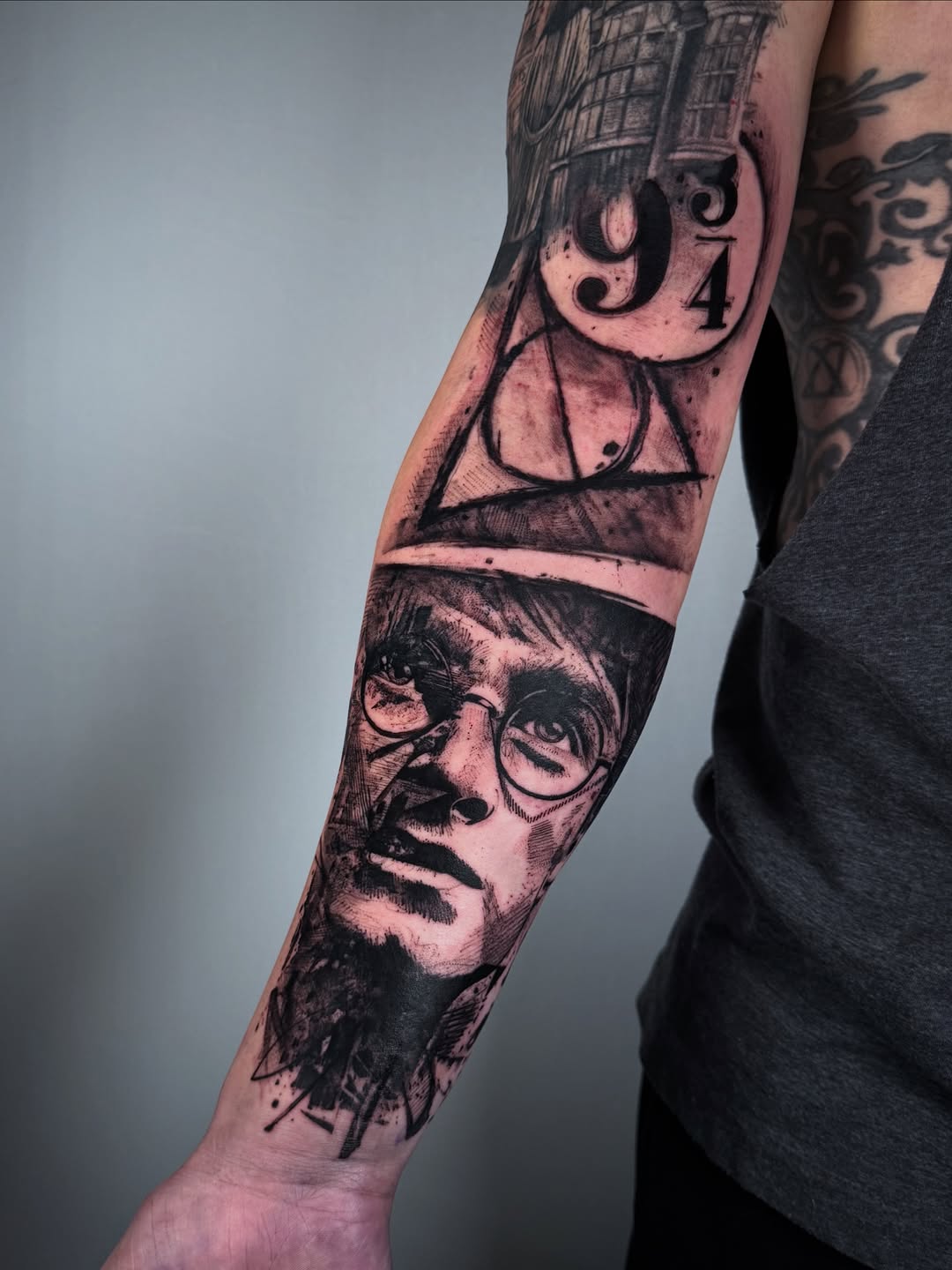 Sketchy black-and-gray Harry Potter portrait with geometric symbols.