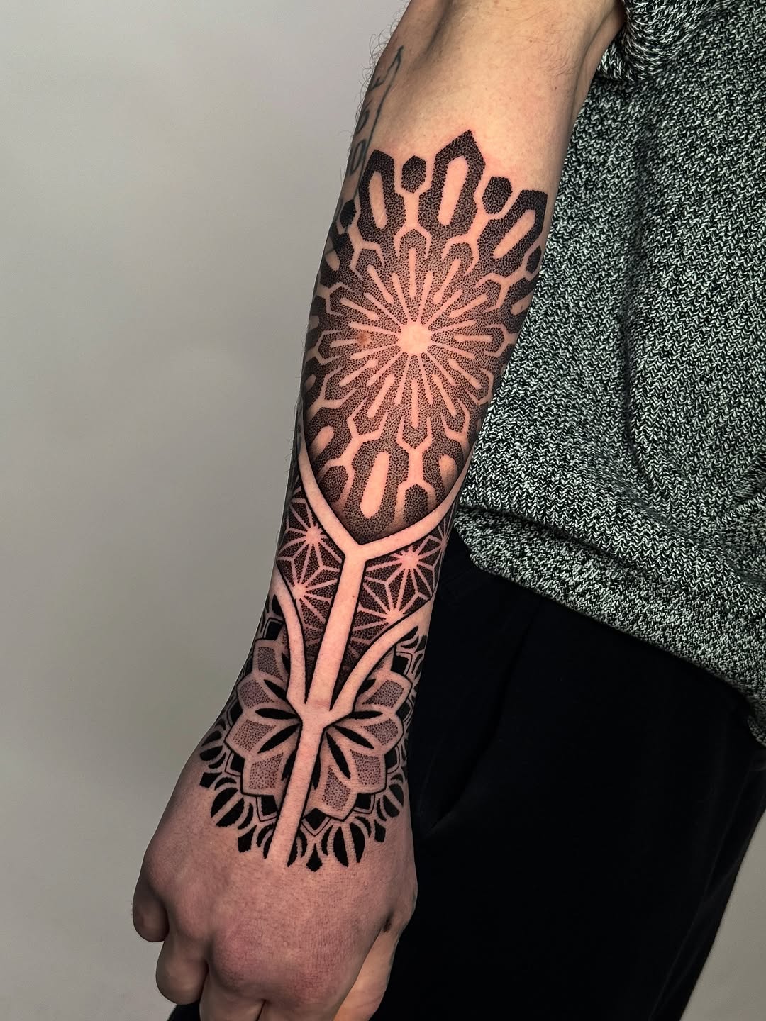Intricate dotwork geometric mandala forearm sleeve