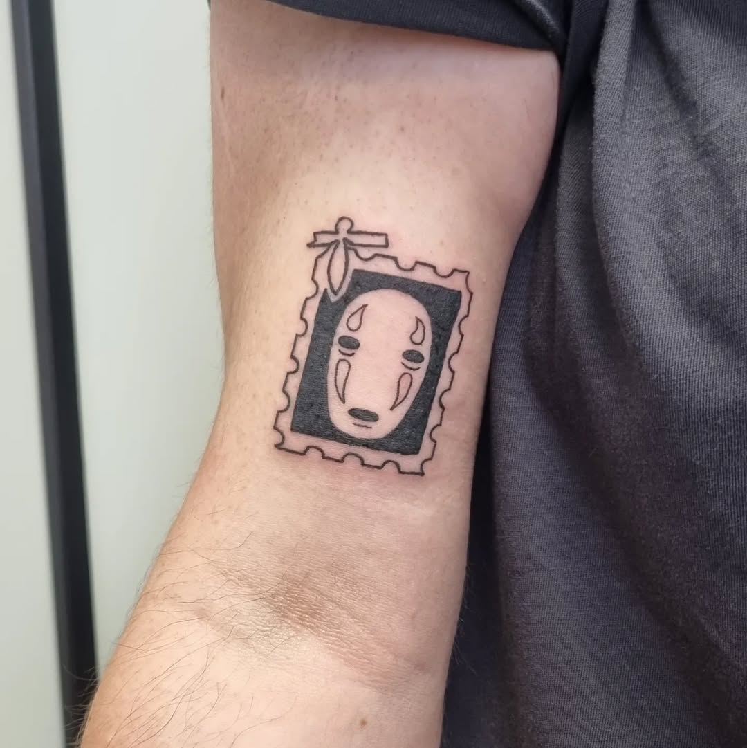 No-Face spirit inside a decorative postage-stamp frame