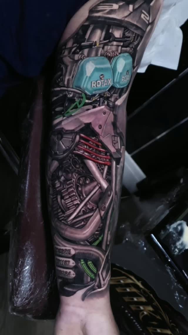 Hyper-detailed biomechanical engine sleeve with turquoise components