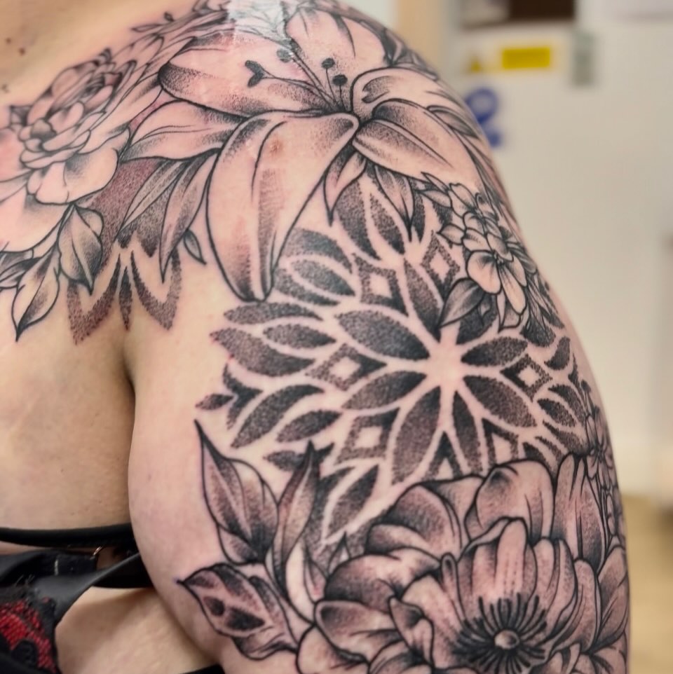 Intricate blackwork floral mandala with dot shading