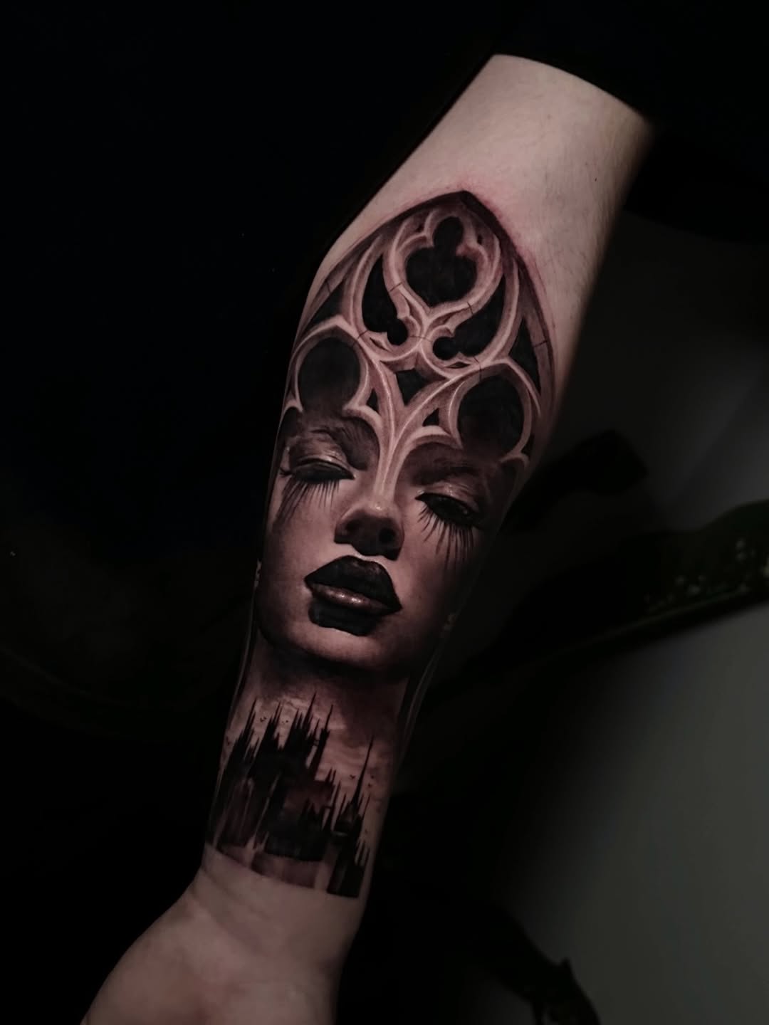 Moody grayscale female portrait with cathedral window overlay and cityscape