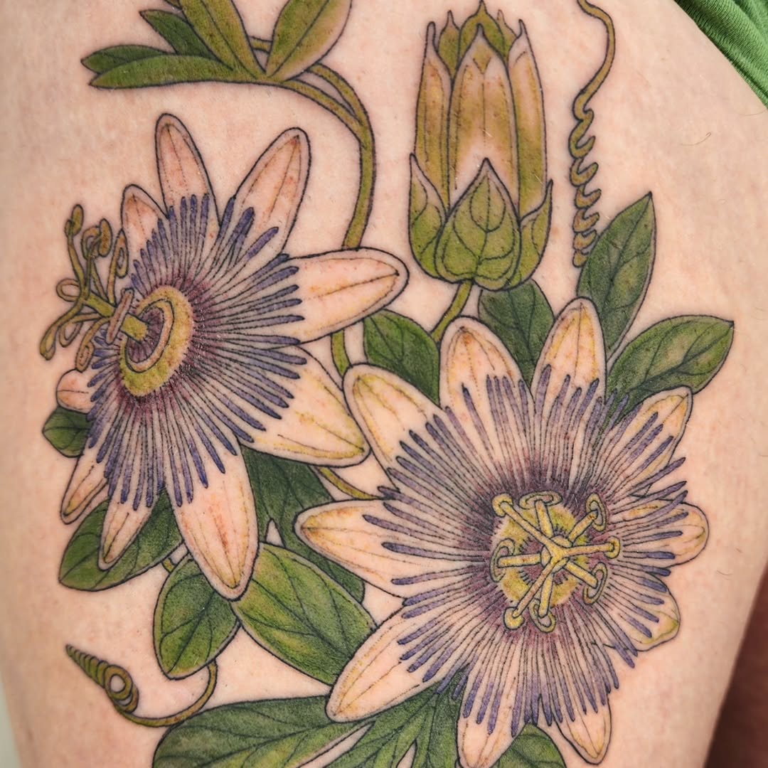 Vivid passionflower bouquet with purple filaments and green leaves