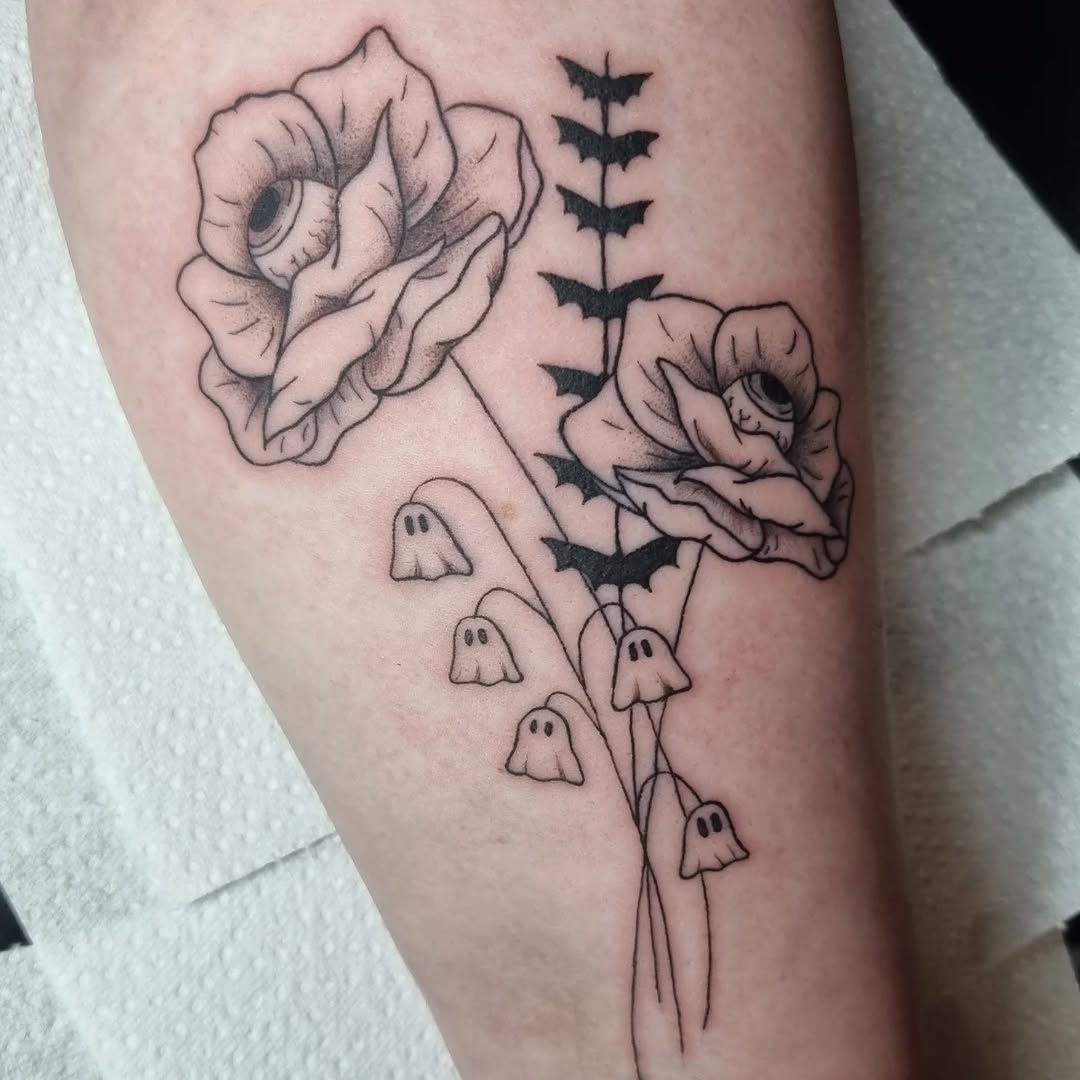 Whimsical Halloween bouquet with eye-centered blooms and bats