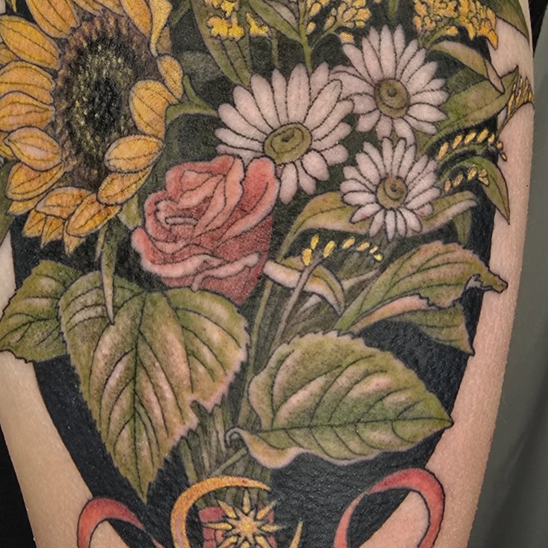 Vibrant floral bouquet with sunflowers, daisies, and rose