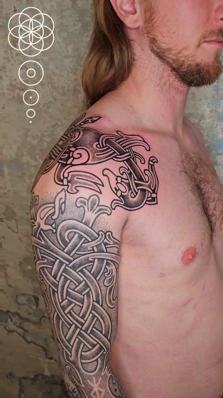 Intricate blackwork knotwork sleeve with interwoven Norse motifs