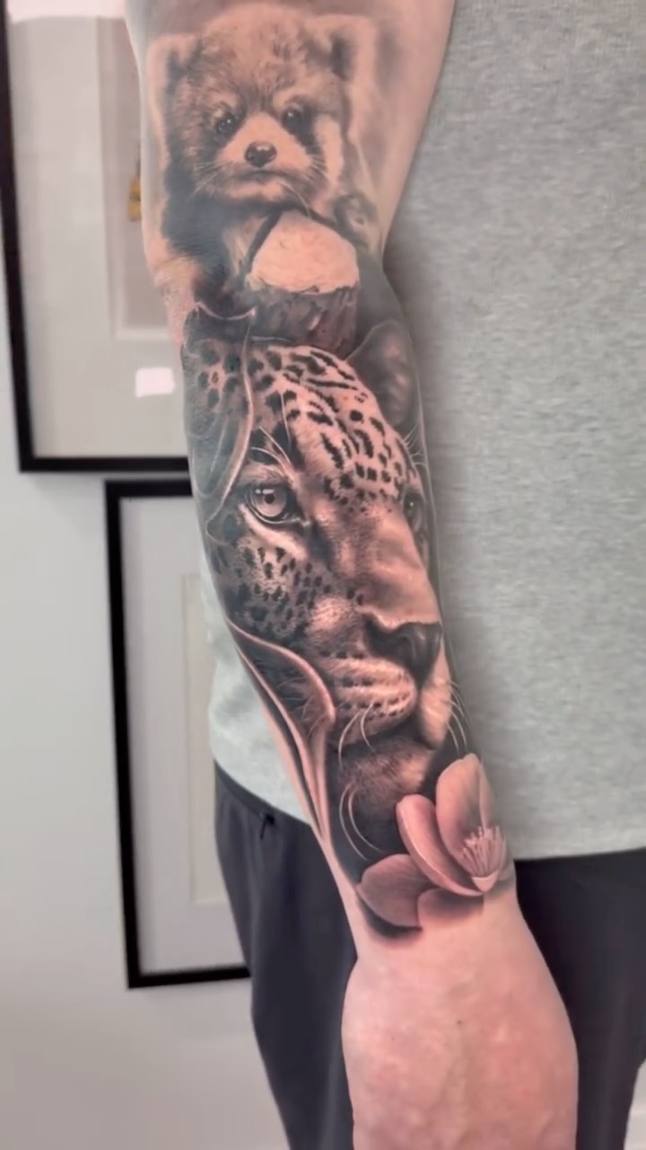 Hyper-real jaguar portrait with a smaller animal and floral accents