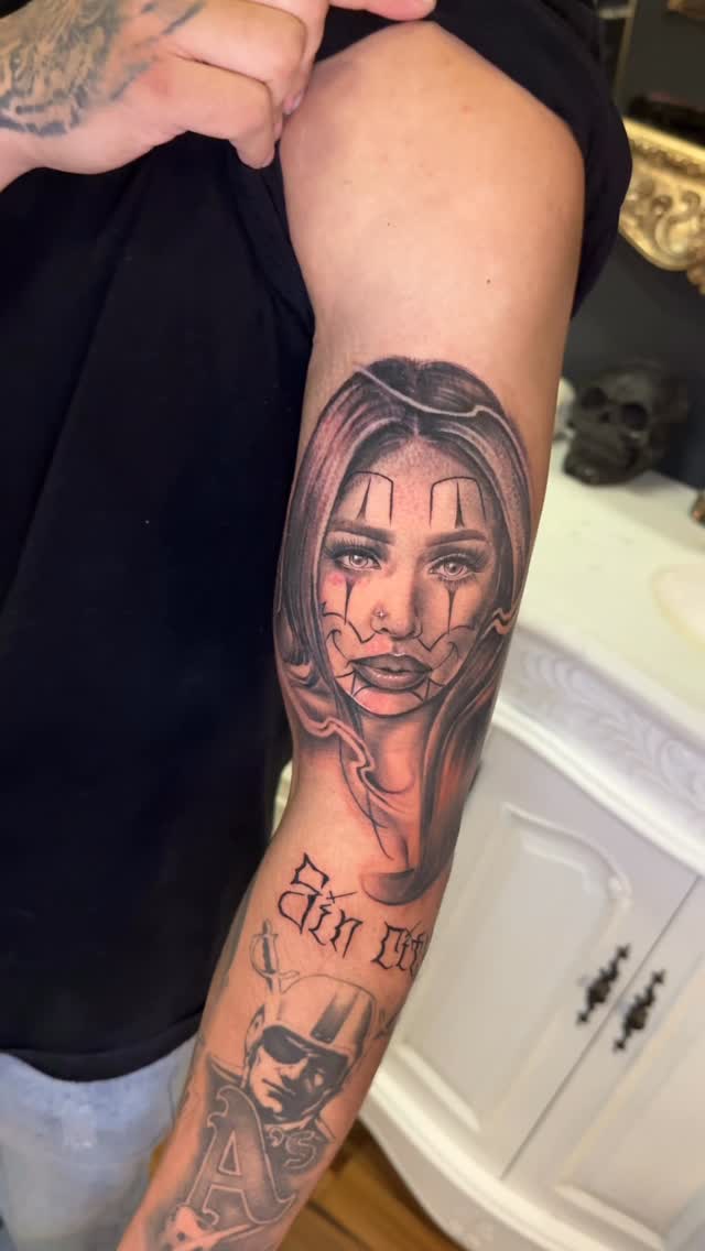 Realistic clown-portrait forearm in grayscale shading