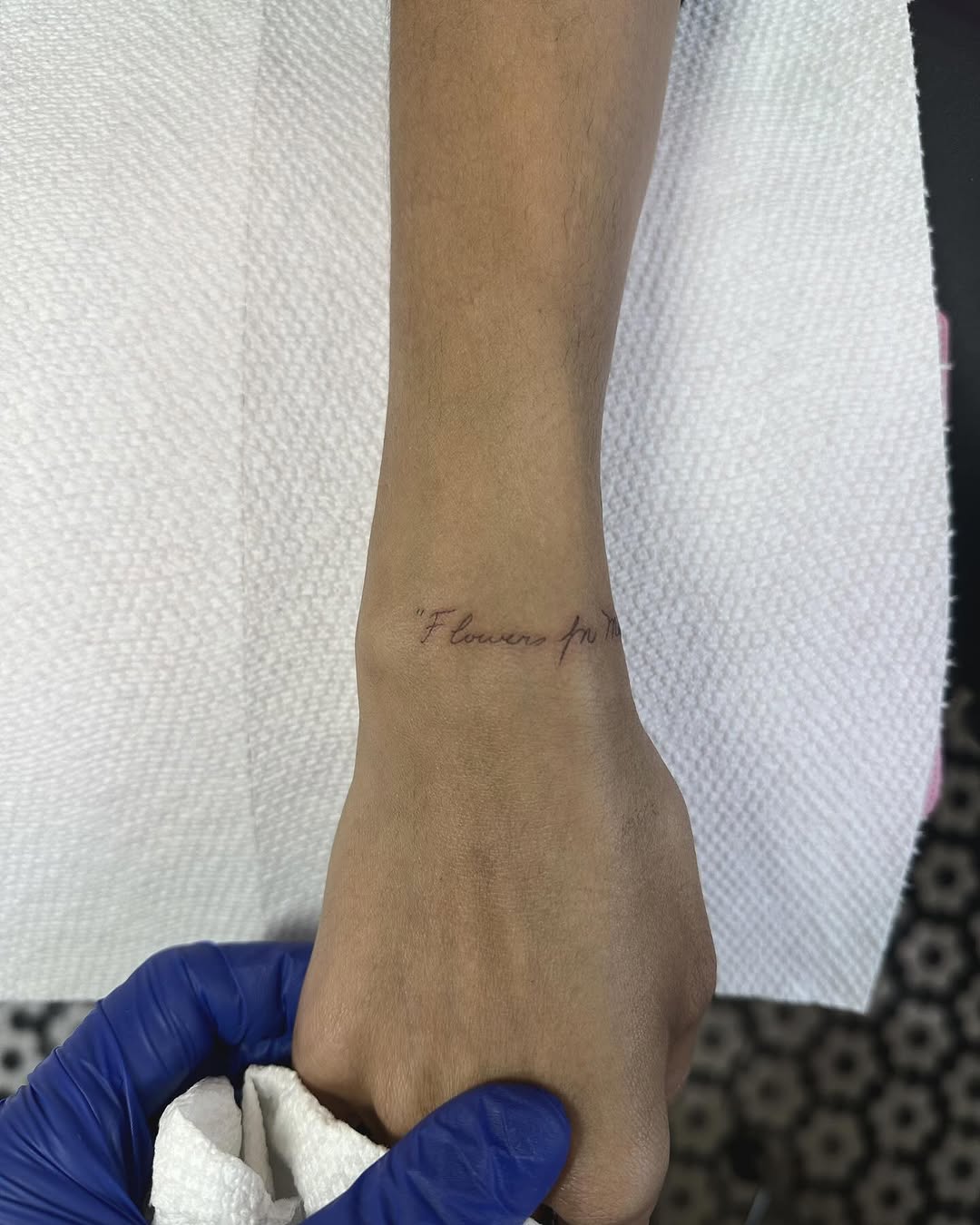 Delicate fine-line script on inner wrist.