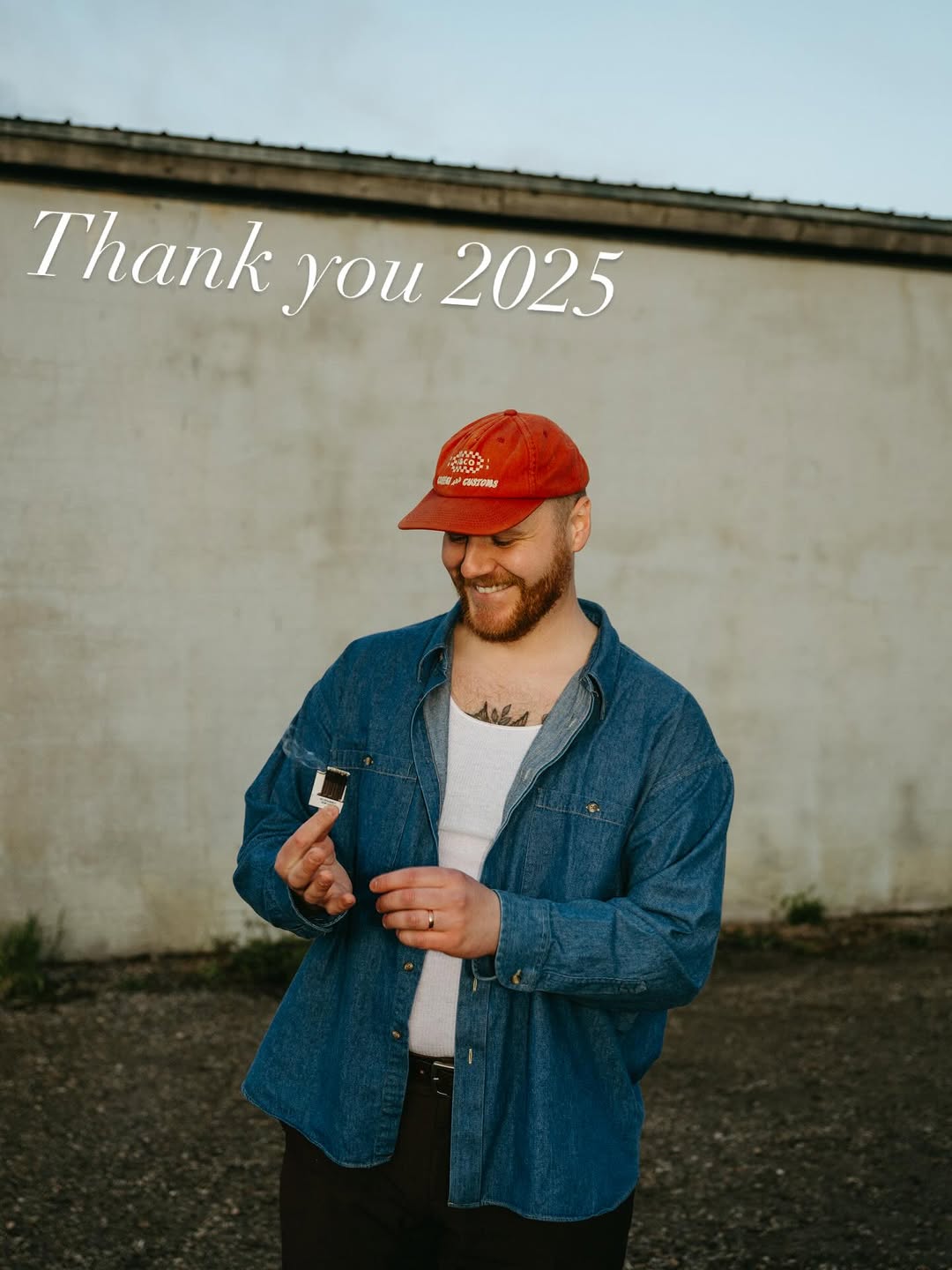Bold black linework botanical chest tattoo with petals