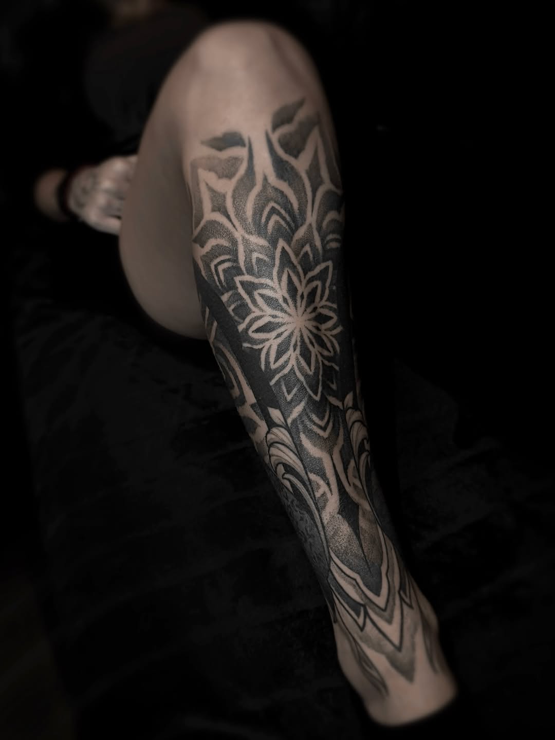 Intricate dotwork mandala calf sleeve with floral motifs