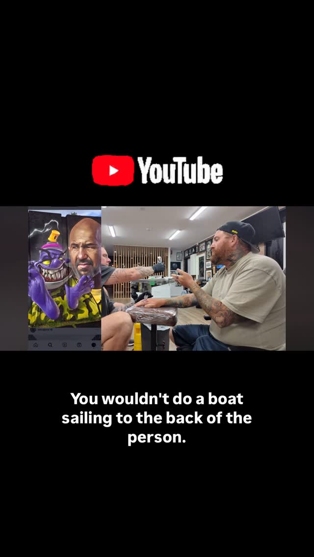 Candid studio session with two tattoo artists at work