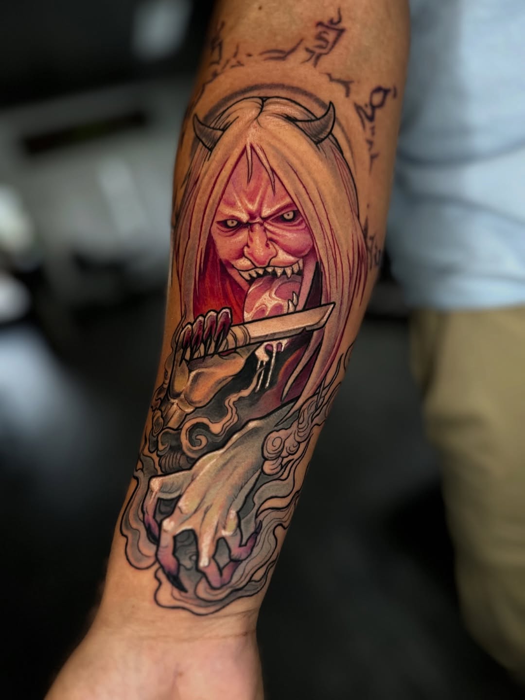 Menacing horned demon snarling, clutching a dagger in crimson