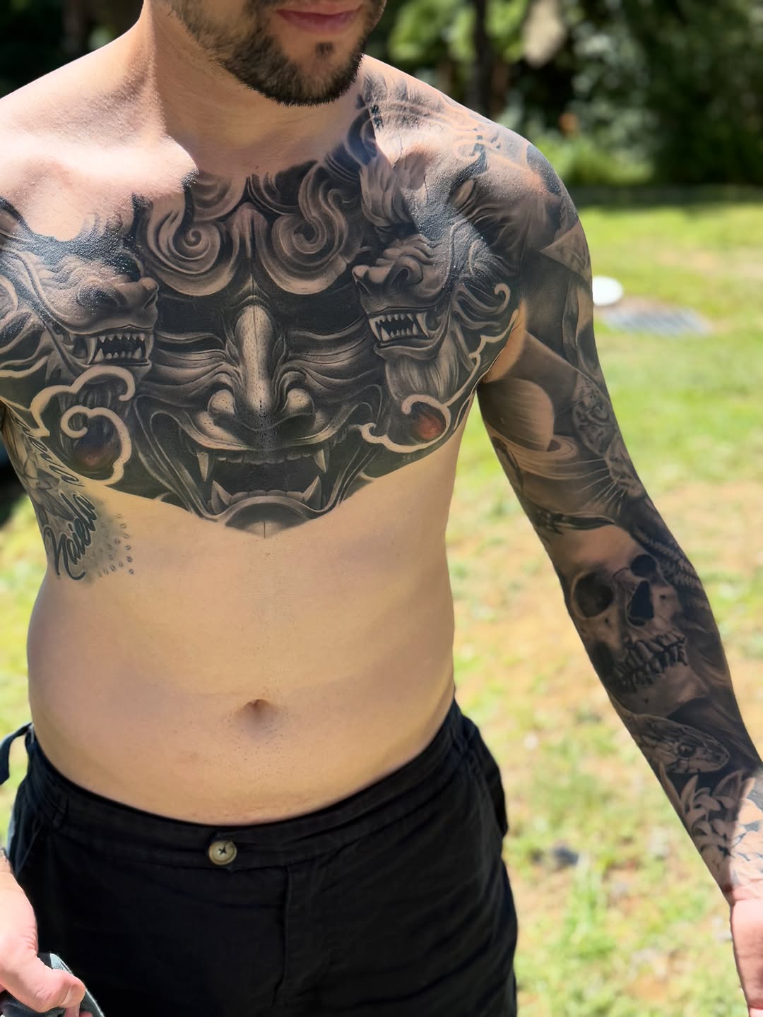 Monstrous grayscale oni-demon chest piece with storm clouds
