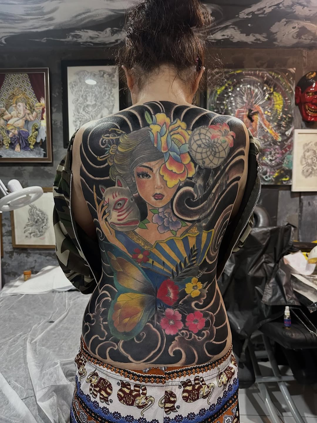 Vibrant Japanese geisha back piece with koi and flowers