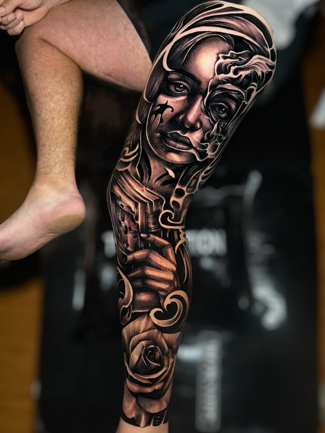 Monochrome female portrait sleeve with swirling florals