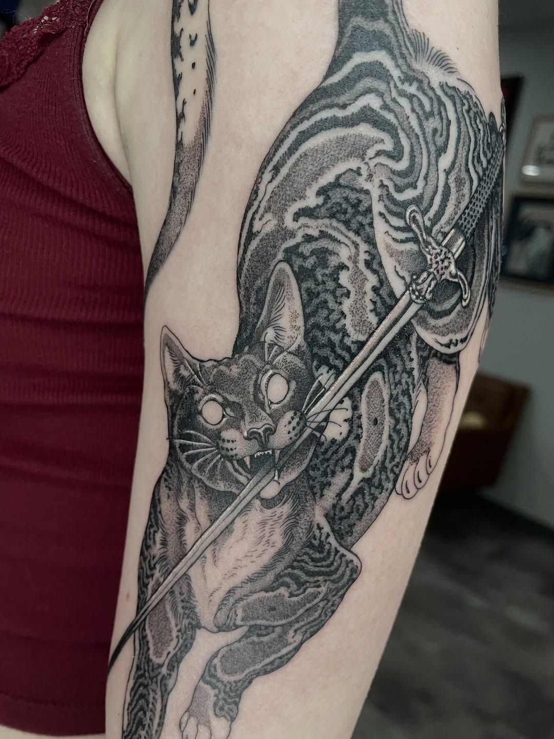 Cat tattoo with sword