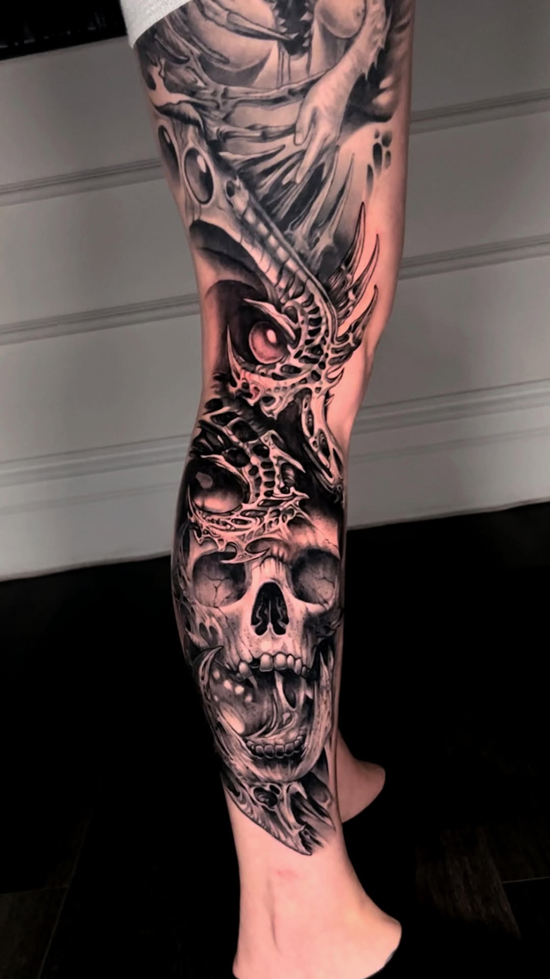 Dark horror leg sleeve with grim skulls and tendrils