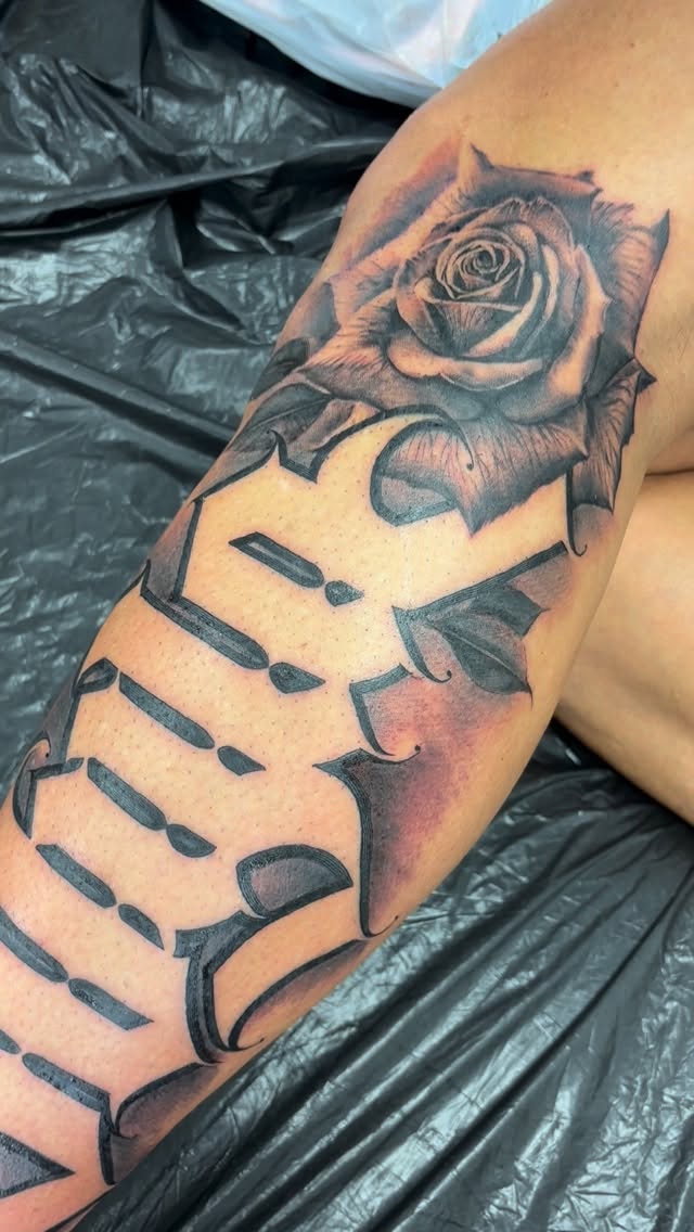 Lush black-and-gray rose with bold outlines and panel facets