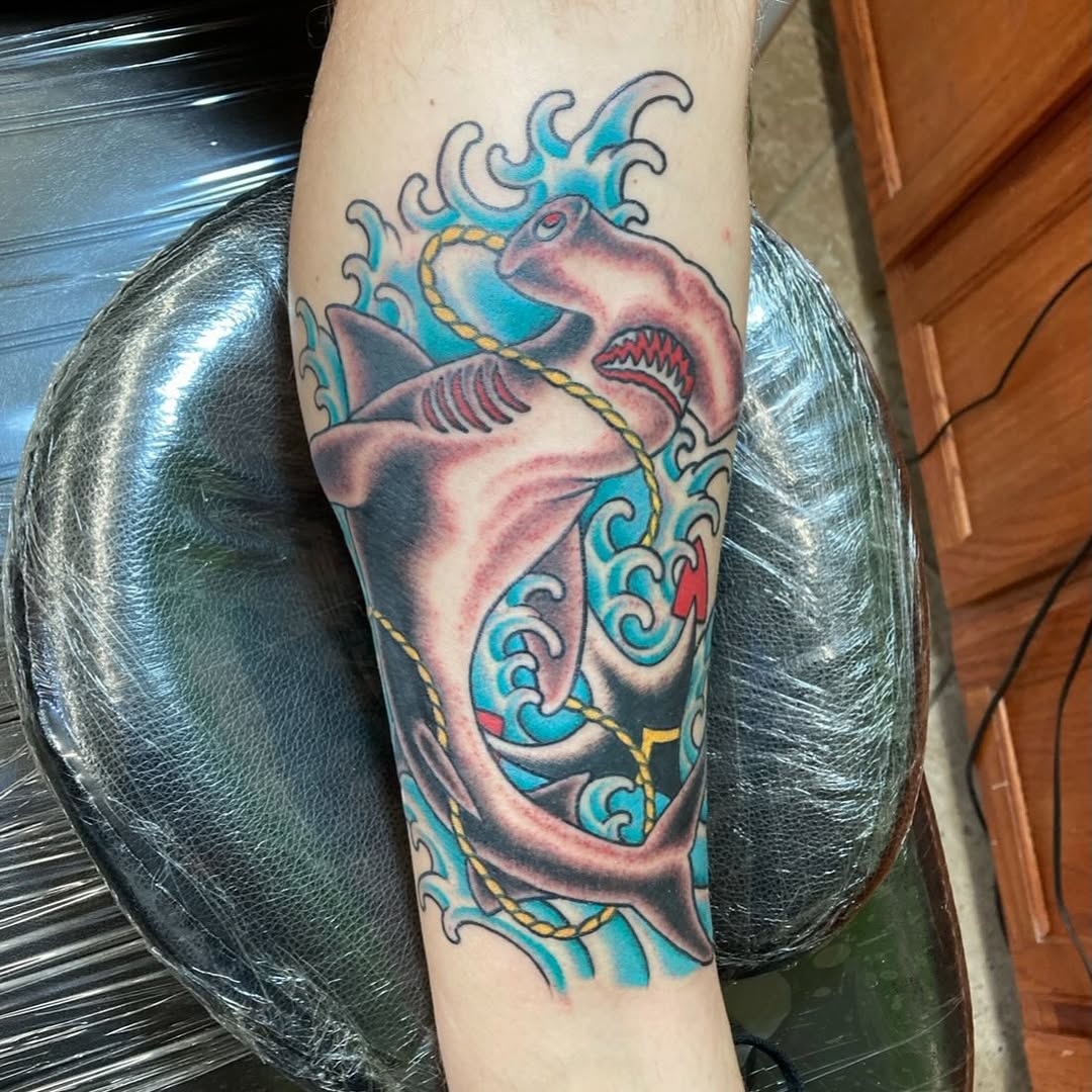 Bold traditional shark with rope entwined amid crashing waves