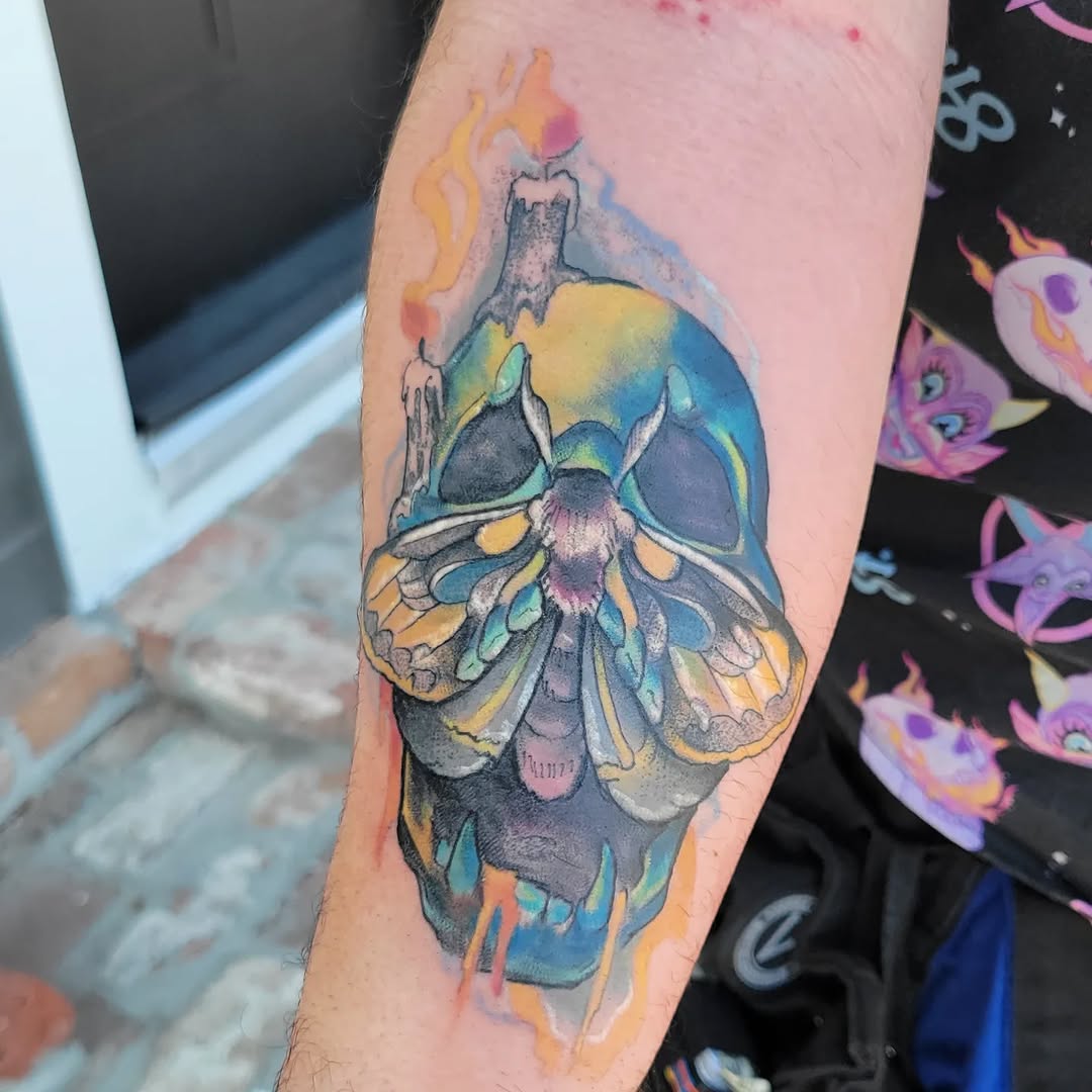Vibrant watercolor moth with radiant, overlapping wings