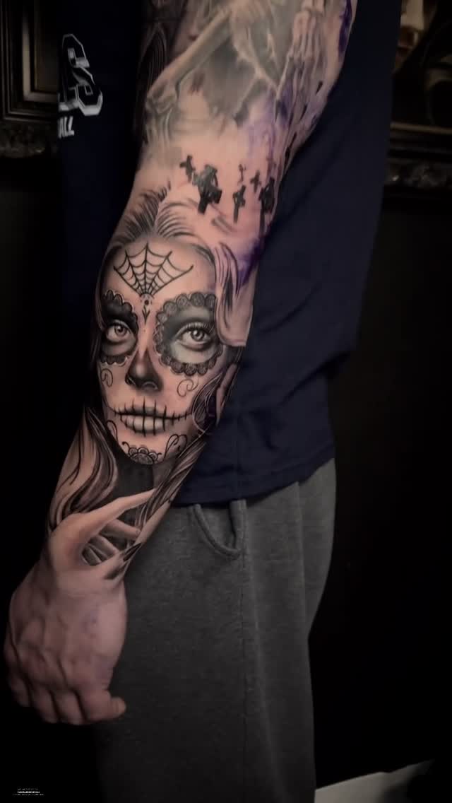 Elegant Day of the Dead sugar skull forearm tattoo with lacework
