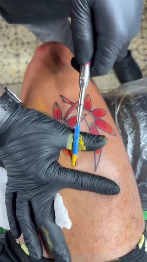 Vibrant hibiscus flower tattoo with crisp lines