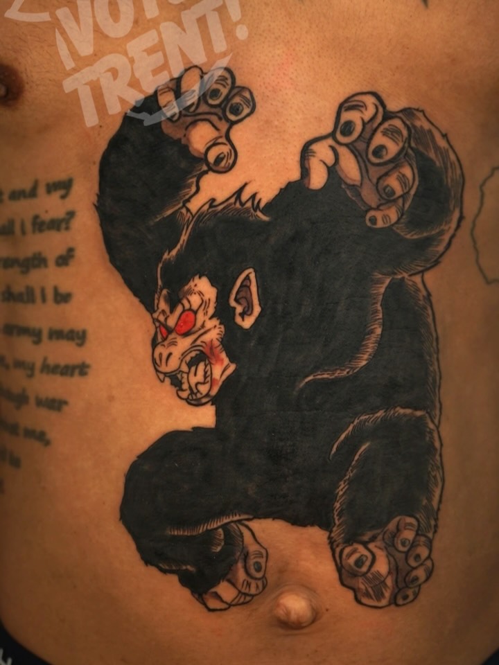 Bold black ape in aggressive stance, red eyes