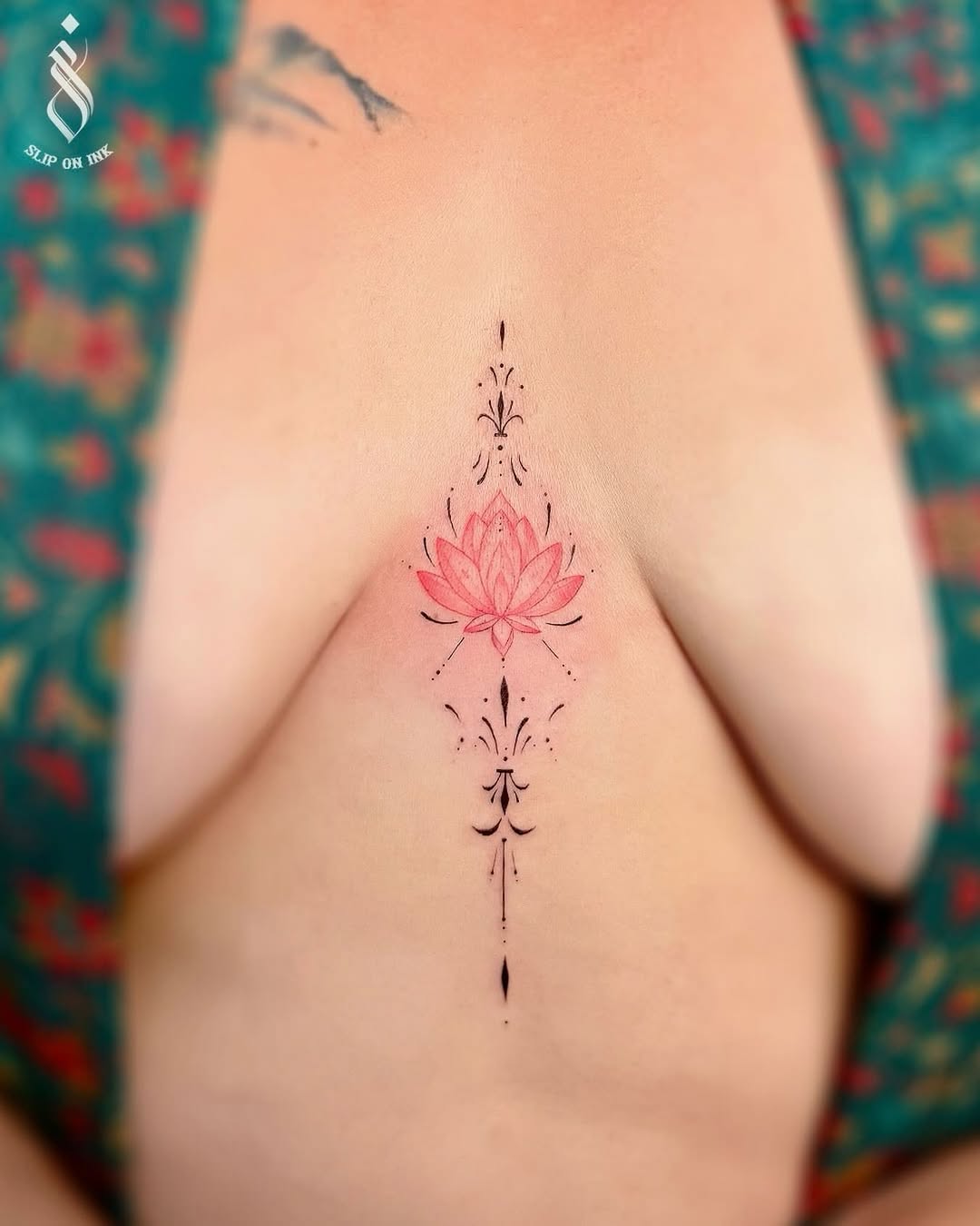 Delicate pink lotus centerpiece with ornate black linework