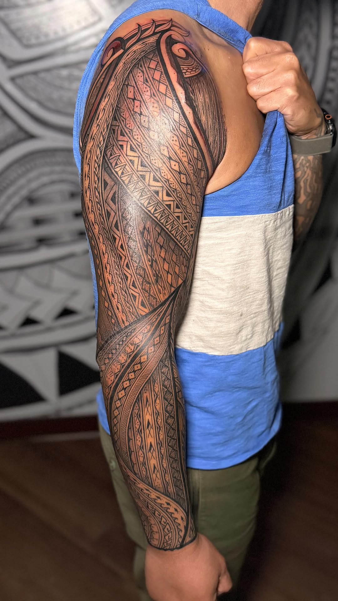 Intricate Polynesian tribal sleeve with bold geometric patterns