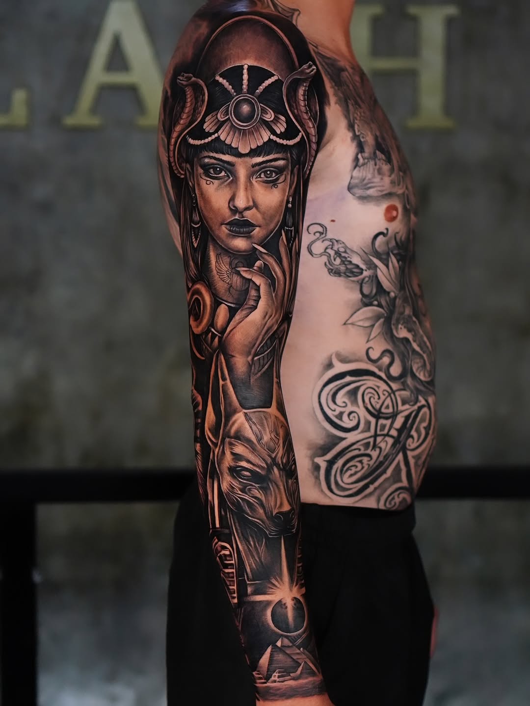 Striking black-and-gray geisha portrait with ornate headdress.