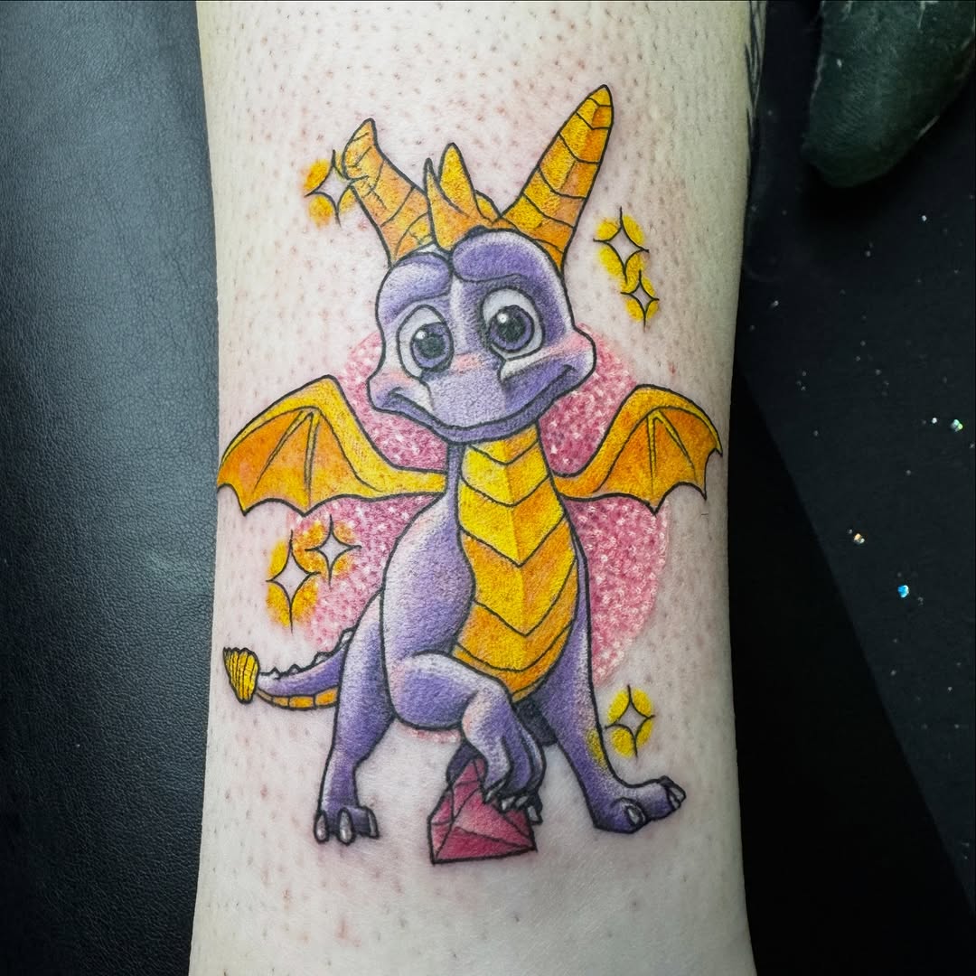 Colorful Spyro dragon tattoo with bold outlines and shading