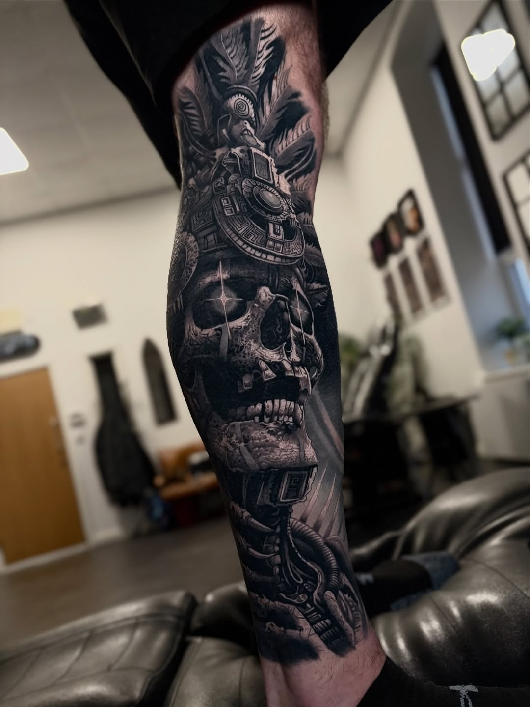 Gothic black-and-gray biomechanical skull fused with Mayan calendar motif