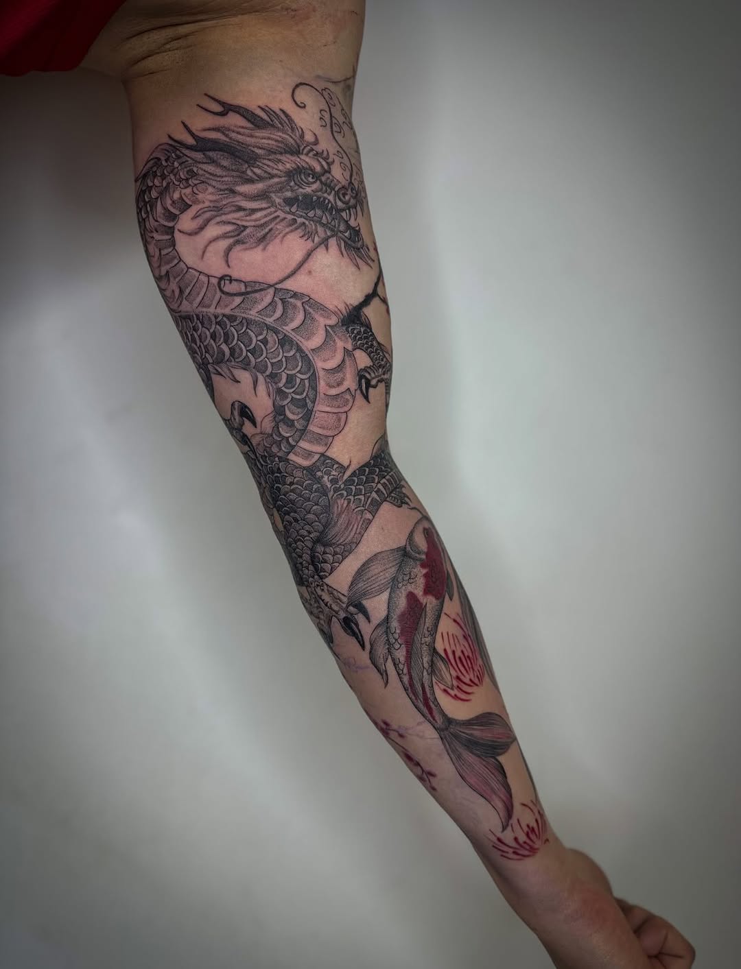 Intricate Japanese dragon and koi, bold blackwork