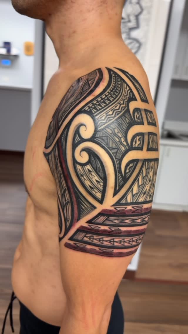 Bold Polynesian tribal sleeve with intricate linework